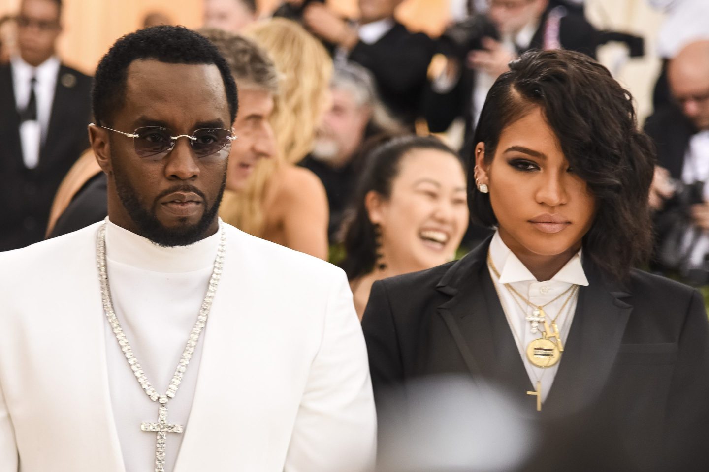 Sean "Diddy" Combs, left, standing next to R&B singer Cassie Ventura
